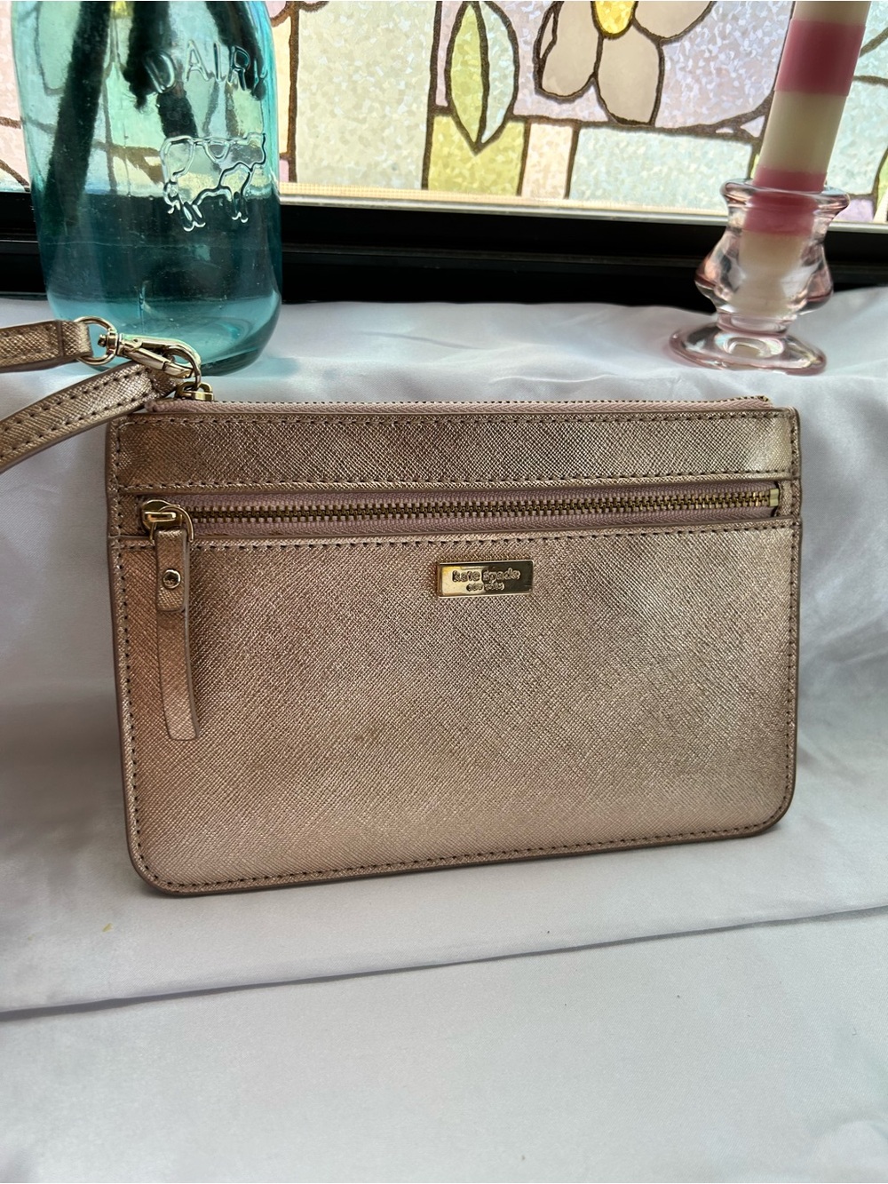 Kate Spade Laurel Way Tinie leather wristlet in rose gold